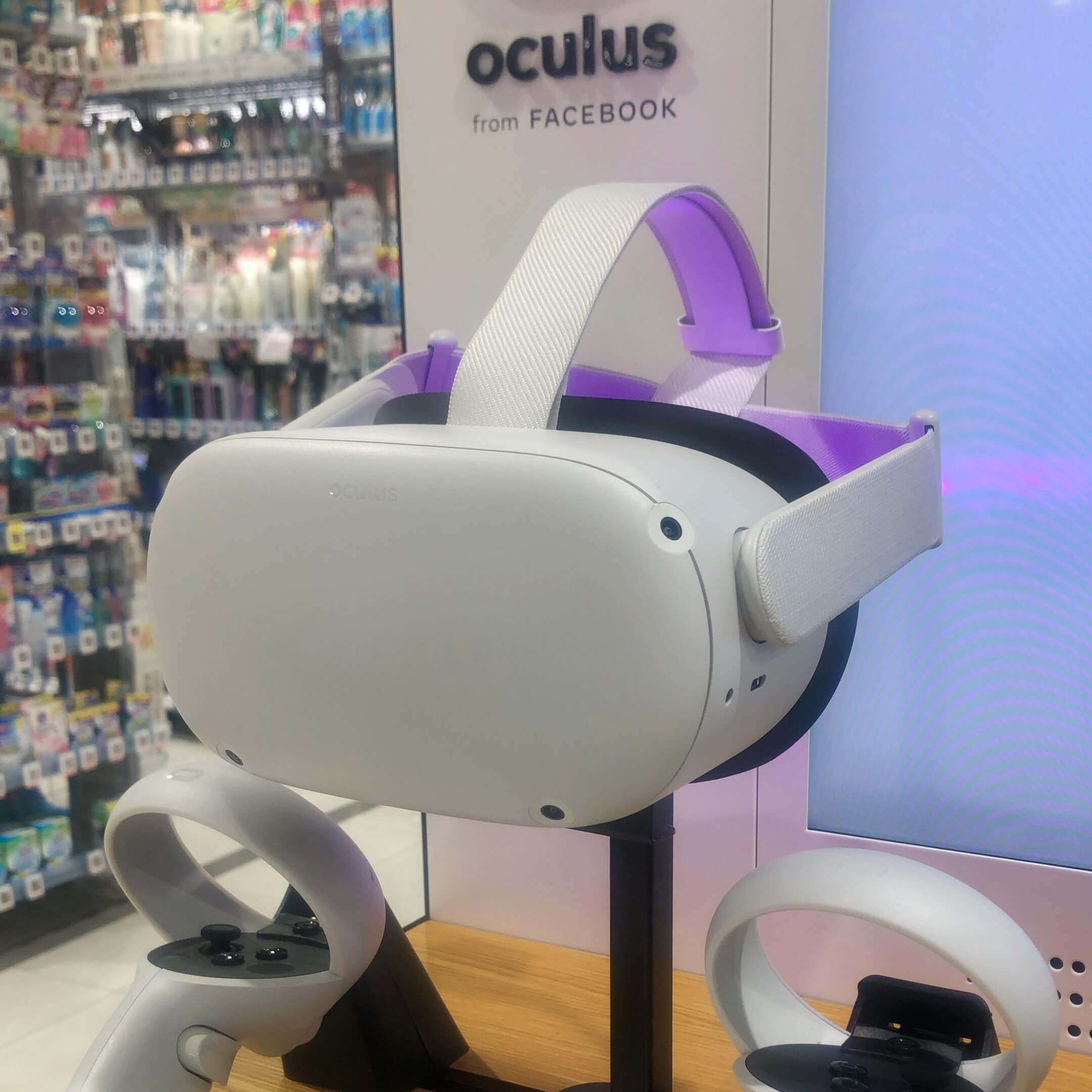 A white Oculus Quest 2 Advanced with hand controls at the bottom of the photo